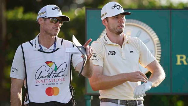 Sam Burns talks with caddie Travis Perkins during the 2022 Arnold Palmer Invitational Bay Hill Club in Orlando, Fla.